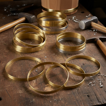 Brass bands fixed around cedar bucket