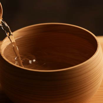 Round ladle bowl shaping a soft water stream